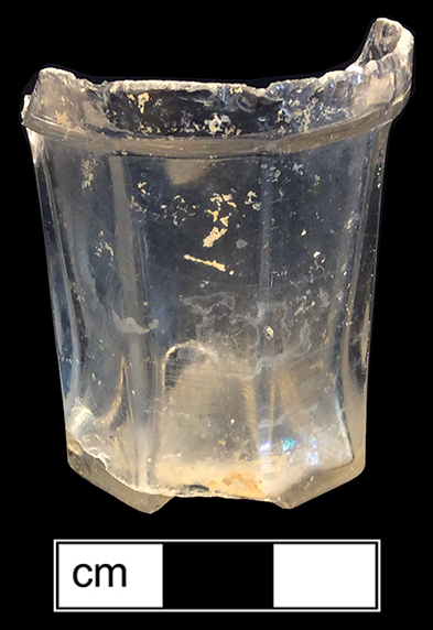 Colorless leaded glass, unknown vessel form. Panelled. Octagonal base, finished pontil. Vessel height: 2 1/16”; Rim diameter:  1 ½”; Base diameter:  1 ¾”, Lot 533. 18FR134